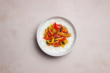 Rice with fried chicken, pepper and sesame. Asian food.