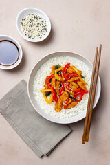 Rice with fried chicken, pepper and sesame. Asian food.