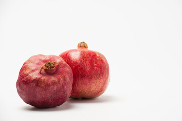 Pomegranate fruit isolated on a white background.