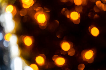 Obraz premium Romantic golden abstract bokeh with black background