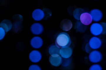 Blue abstract bokeh lights with black background