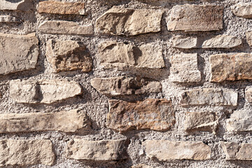 Stone wall texture, rough rectangular rock bricks
