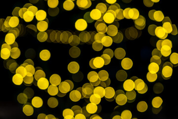 Elegant and romantic golden Christmas lights background with bokeh