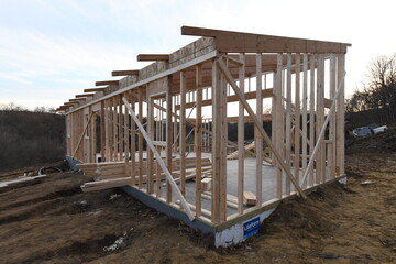 New house construction in the winter, wood framing.