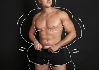 Athletic man after weight loss on black background, closeup view