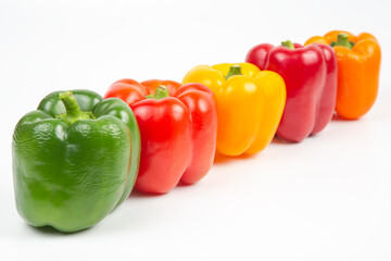 colored bell peppers on a white background. vitamin food