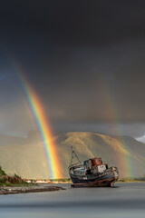 Extreme Weather,  Wreck of an old abandoned boat near Fort William in the Scottish Highlands with a...