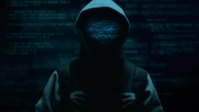 Computer hacker with hoodie and glitch face. Computer abstract digital code at the background. Darknet fraud and cryptocurrency bitcoin concept. Cybersecurity and data protection in social network