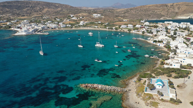 Aerial drone photo of picturesque Pollonia a quiet, family -friendly village on the north-east corner of Milos island, Cyclades, Greece