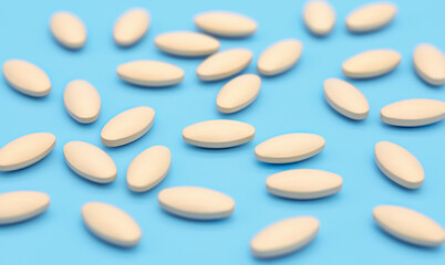 oval-shaped tablets lie on a contrasting background