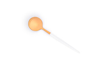 A golden spoon isolated on a white background.