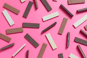 Chocolate wafers on pink background	