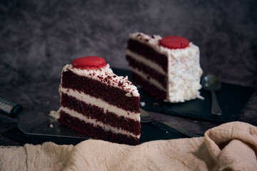 two pieces of red velvet cake with cookies on top
