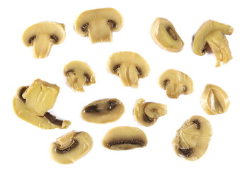 Champignon mushrooms slices pile isolated on white, top view  