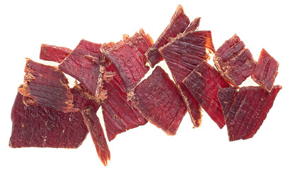 Portion of sliced and dried meat isolated on a white background. Top view of beef jerky pieces.