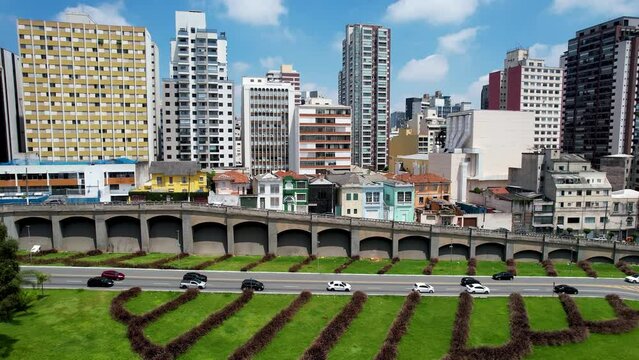Panning wide of famous intersection between East Radial highway road and May 23 avenue at downtown Sao Paulo. East west link of regions of city. Transportation scenery.