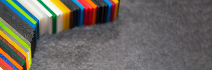 Multi-colored samples of organic glass. Colorful acrylic sheets plastic swatches, craft and...
