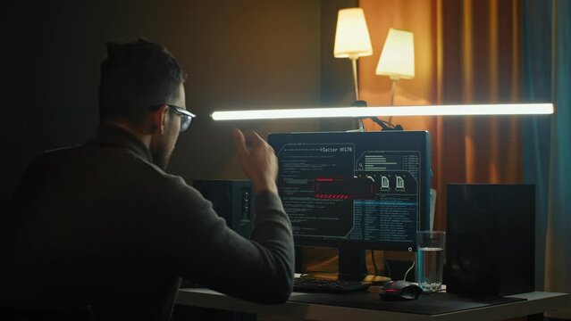 Digital threat by male cyber criminal computer hacker typing code while trying to break into a computer network 