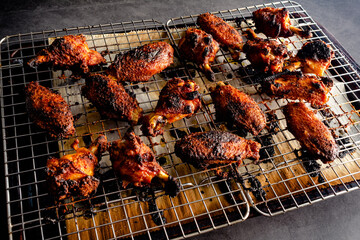 Crispy Baked Chicken Wings on a Sheet Pan: Broiled chicken wings arranged on a wire rack