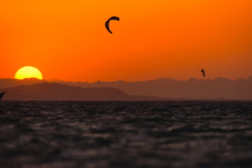 Fototapeta na wymiar Sunset kiteboarding