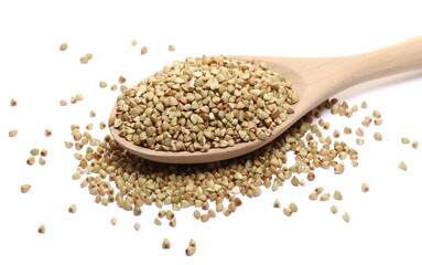 Buckwheat pile in wooden spoon isolated on white  