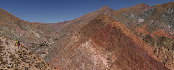 Person contemplating the landscape of mountains in northern Argentina