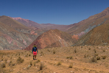 Man trekking through Argentine mountains