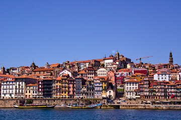 Naklejka na ściany i meble View of the Douro River as it passes through Porto and the buildings by the shore
