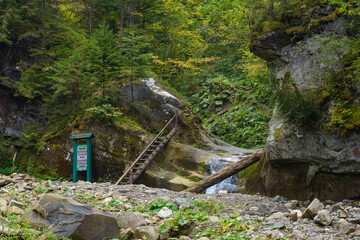 Waterfall Vorota, Bukovynski cascades in Velykyi Roztoky in the autumn forest. Carpathian Mountains, Chernivtsi oblast, Ukraine.