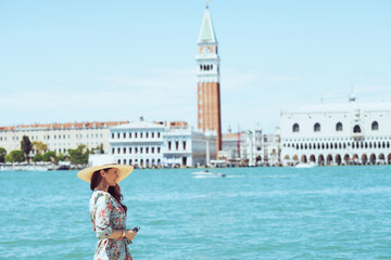relaxed young woman in floral dress having walking tour