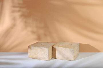 Abstract background with natural wooden podiums and long shadows on a pastel wall, an empty...