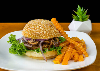 plant based hamburger top with mushrooms and onions,