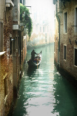 Romantic Venetian canals. Old narrow streets of Venice. Gondola trip. Italy © Freesurf