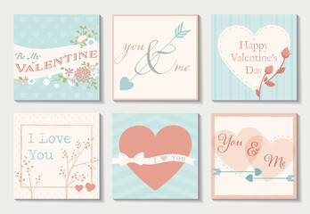 A set of six Valentine cards in rose, teal, and off white. Floral and heart designs.
