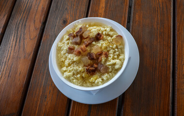 Banosh, ukrainian traditional dish in Carpathian (maize porridge) with bacon, cracklings and cheese