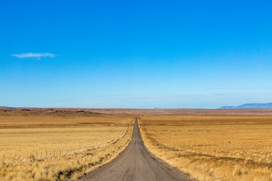 USA, Nevada, Winnemucca, Empty desert road and blue sky