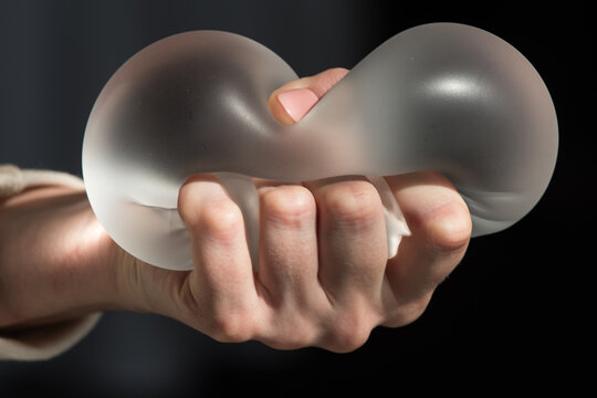 Silicone implant of the female breast during the demonstration of its quality.