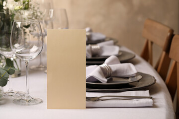 Stylish elegant table setting for festive dinner in restaurant