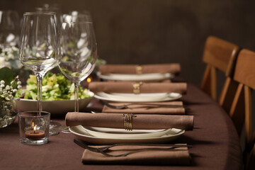 Stylish elegant table setting for festive dinner in restaurant