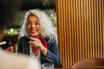 Blonde woman at the cafe with friend