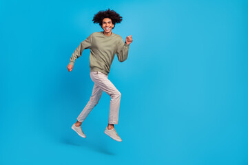 Fototapeta na wymiar Full length profile side photo of young guy run rush motion energetic discount isolated over blue color background