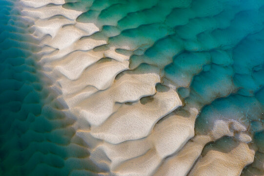 Aerial view of a river with sand bar exposed at low tide, Oregon coast, USA.