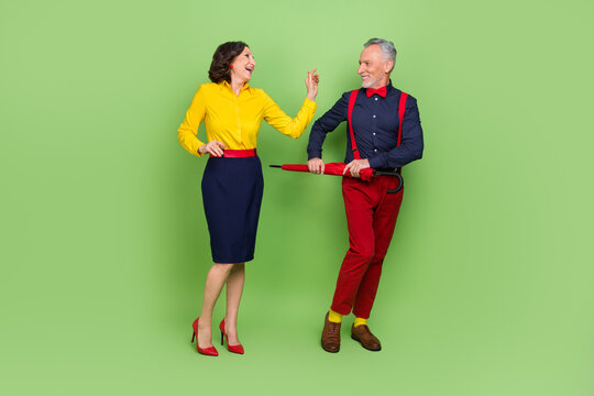 Full size photo of elegant classy partners enjoy holiday discotheque event isolated on green color background - Powered by Adobe