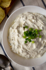 Homemade Clam Dip with Potato Chips, top view. Flat lay, overhead, from above.
