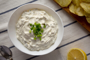 Homemade Clam Dip with Potato Chips, top view. Flat lay, overhead, from above.