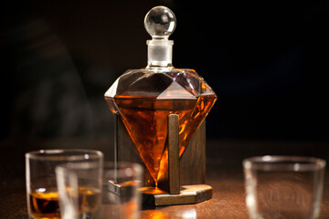Whisky decanter on wooden table