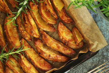 A tray with potatoes backed in oven	