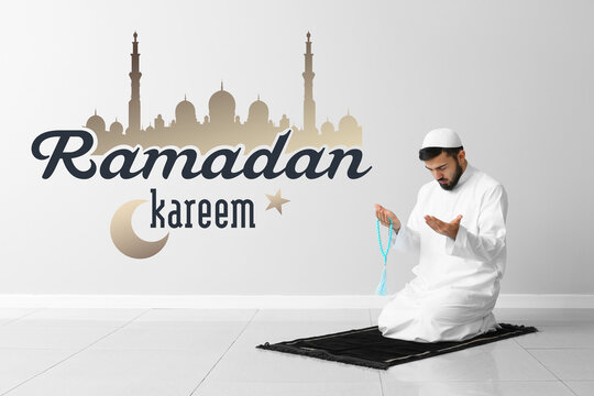 Praying Muslim man at home. Ramadan celebration