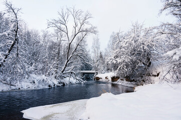 Winter landscape scenery along River Amata trail during snowy winter.