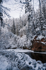 Winter landscape scenery along River Amata trail during snowy winter.